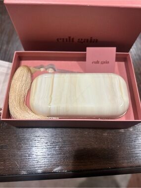 cult gaia cream marbled resin clutch with gold tassel